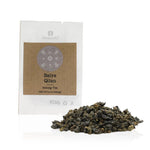 Tea package labeled 'Baiya Qilan' with tea leaves on a white background