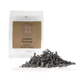 Beaworld Lingtou Dancong oolong tea package with loose tea leaves on a white background