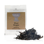 Rougui oolong tea package with loose tea leaves on a white background