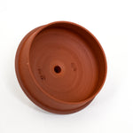 Terracotta pot on a white background