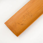 Wooden tray with engraved design on a white background