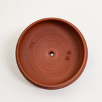 Terracotta pot on a white background